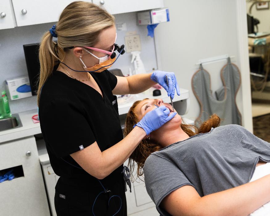 dentist working with patient | dental crowns cheshire ct
