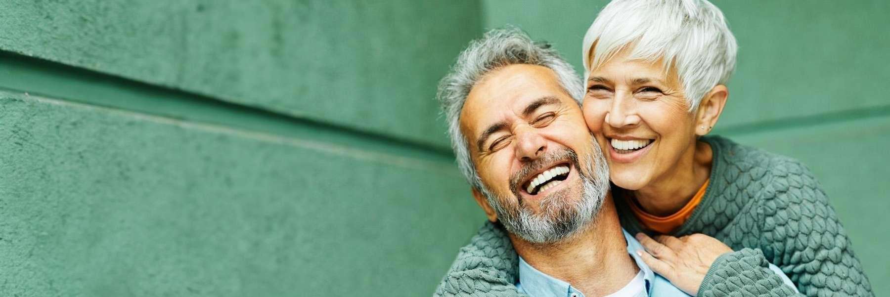 older couple hugging | dentists in cheshire ct