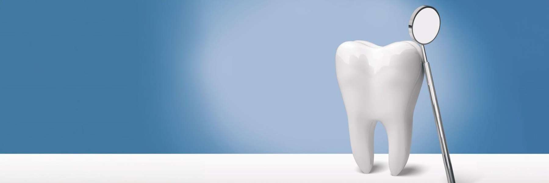 close up of tooth with dental tool | dentist near me