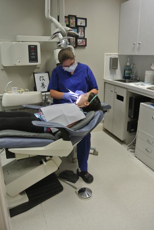 dental staff treating a patient | dentist near me